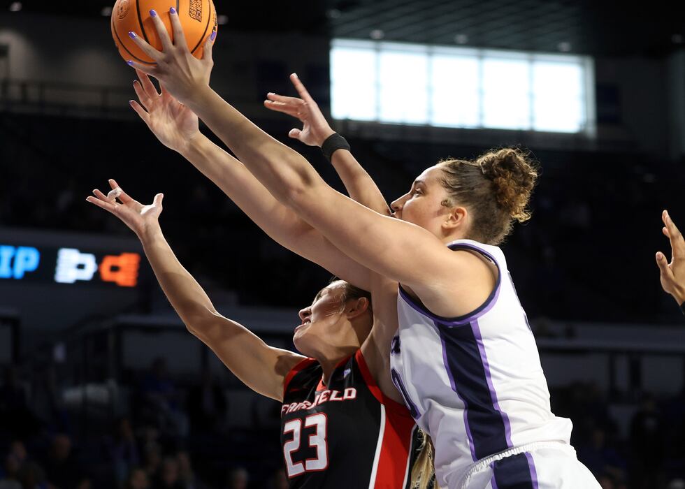 Kansas State's Ayoka Lee, right, and Fairfield's Emina Selimovic (23) battle for a rebound in...
