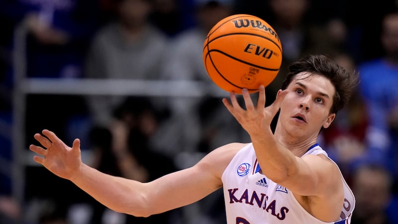 Kansas forward Zach Clemence (21) chases a loose ball during the second half of an NCAA...