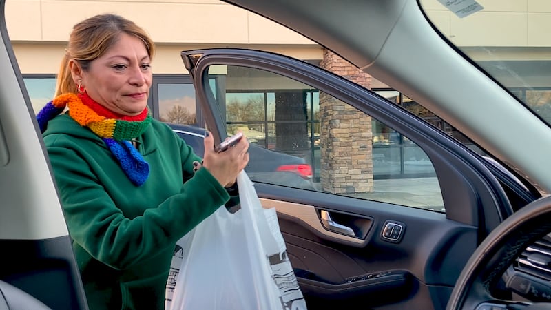 Paola Ramirez, a single mother of two, works as an Uber Eats driver, sells essential oils,...