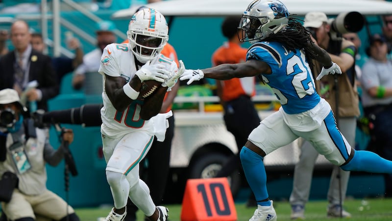 Miami Dolphins wide receiver Tyreek Hill (10) grabs a pass for a touchdown as Carolina...