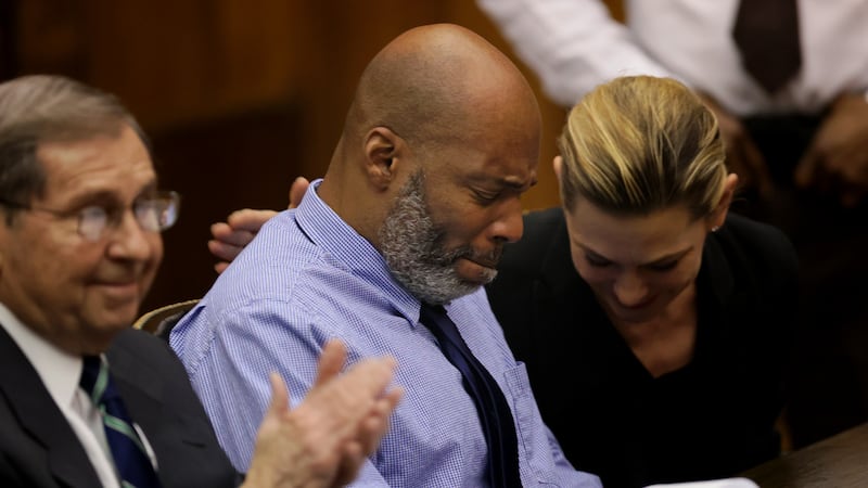 Lamar Johnson, center and his attorneys react on Tuesday, Feb. 14, 2023, after St. Louis...