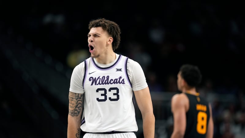 Kansas State's Coleman Hawkins (33) celebrates after making a 3-point basket during the first...