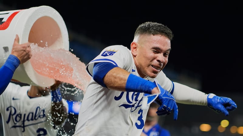 Kansas City Royals' Freddy Fermin is doused by teammates after hitting a walk-off single in...