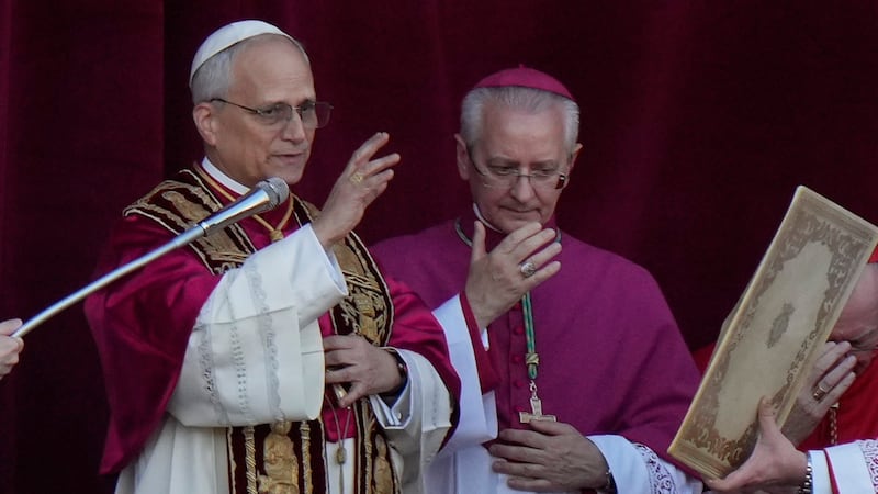 Pope Leo XIV delivers his blessing from the balcony of St Peter's Basilica after his election,...
