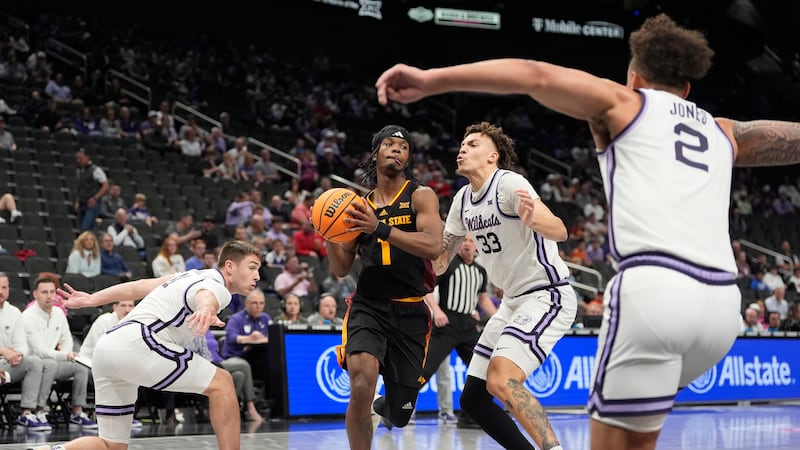 Arizona State's Alston Mason (1) heads to the basket as Kansas State's Brendan Hausen (11),...