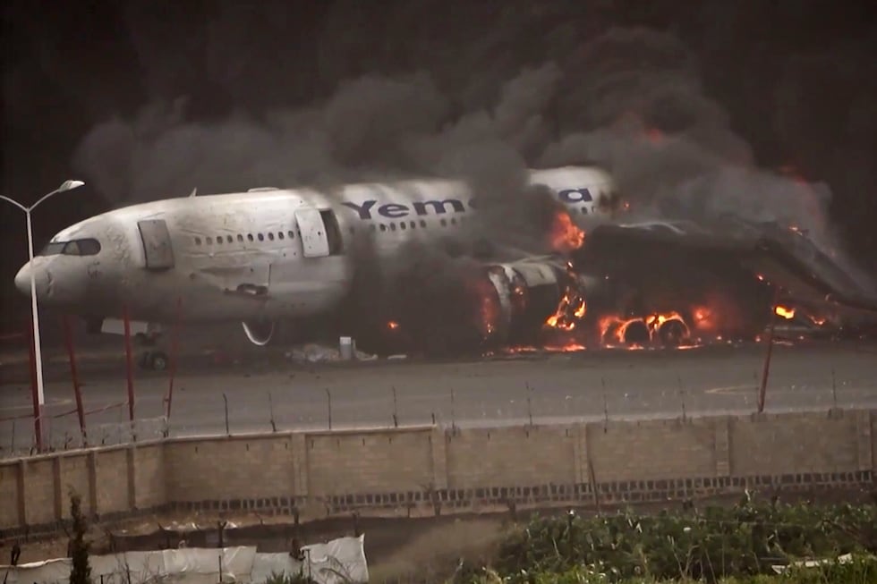 This frame grab from a handout video provided by the Ansar Allah Media Office shows smoke...