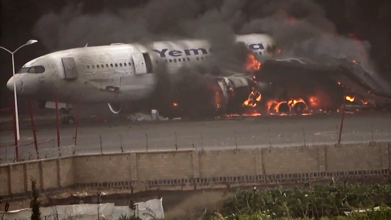 This frame grab from a handout video provided by the Ansar Allah Media Office shows smoke...