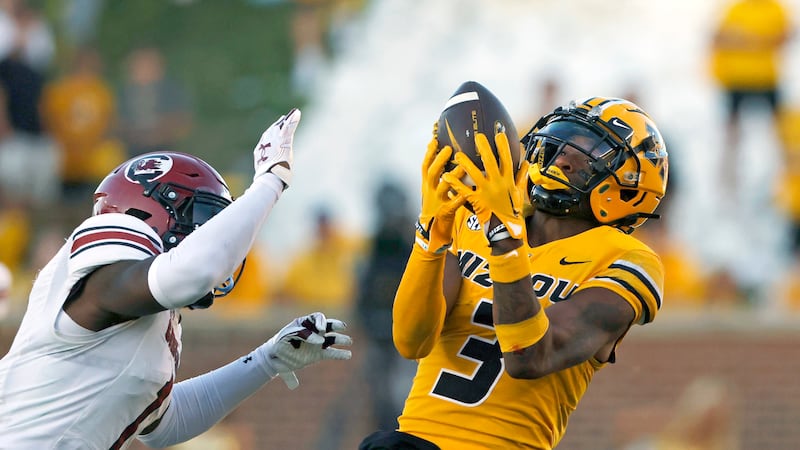 FILE - Missouri wide receiver Luther Burden III (3) catches a pass for a first down as South...