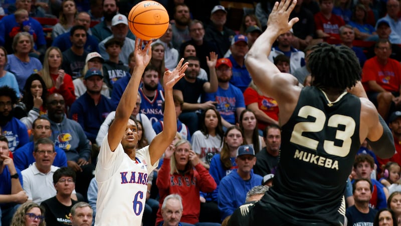 Kansas guard Rylan Griffen (6) scores a 3-point basket as Oakland forward Allen Mukeba (23)...