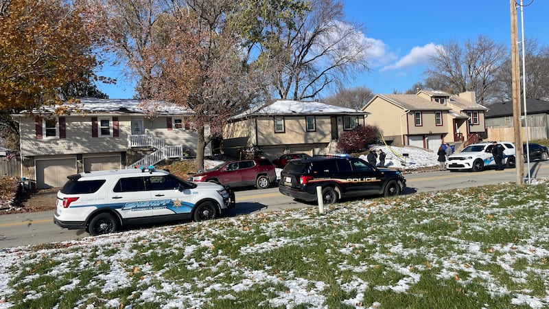 Police set up a crime scene outside the home of former KCKPD detective Roger Golubski.