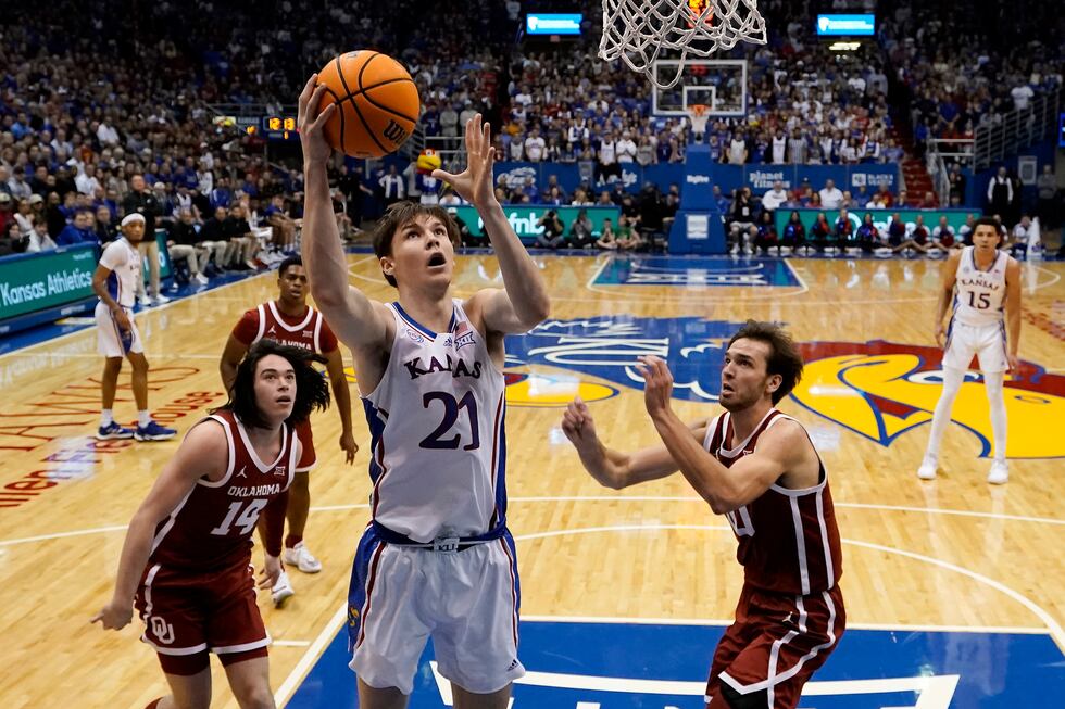 Kansas forward Zach Clemence (21) puts up a shot during the first half of an NCAA college...