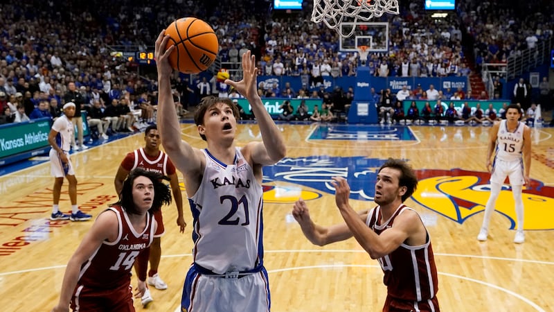 Kansas forward Zach Clemence (21) puts up a shot during the first half of an NCAA college...