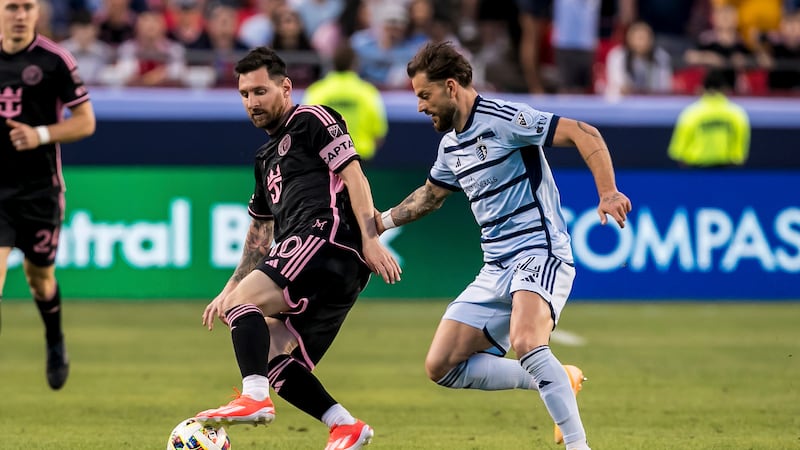 Inter Miami forward Lionel Messi (10) attempts to bypass Sporting Kansas City defender Tim...