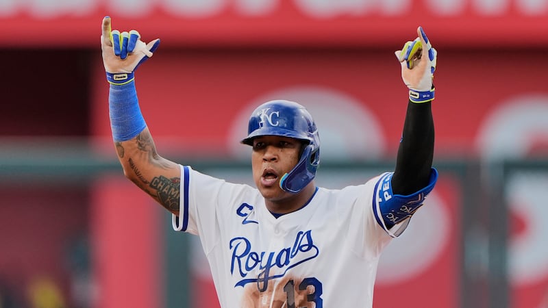Kansas City Royals' Salvador Perez celebrates on second after hitting a two-run double during...