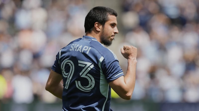 Sporting Kansas City forward Magomed Suleymanov celebrates after scoring a goal during the...