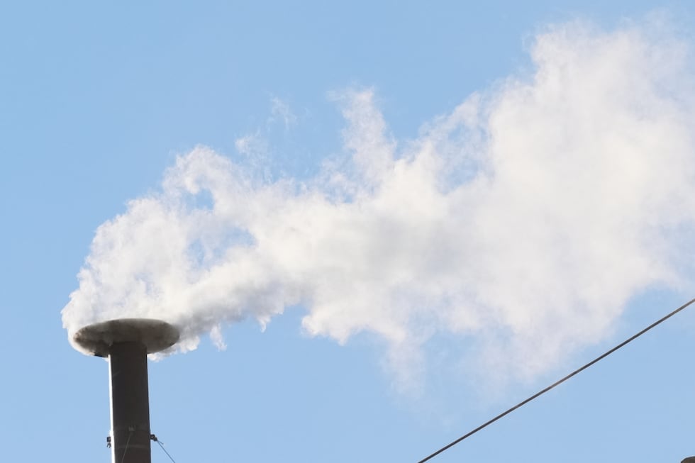 White smoke billows from the chimney of the Sistine Chapel during the conclave to elect a new...