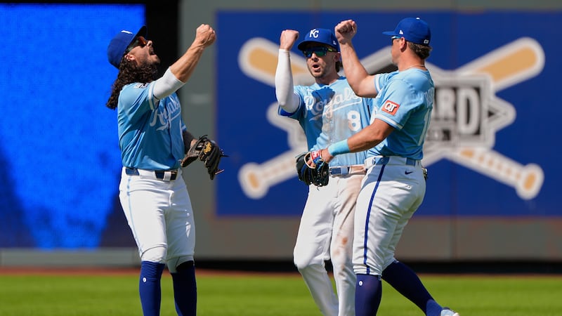 Kansas City Royals outfielders Jonathan India, left, Drew Waters (8) and Hunter Renfroe,...