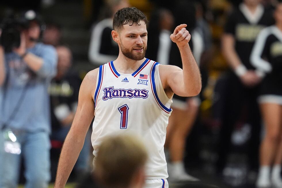Kansas center Hunter Dickinson gestures after scoring a basket late in the second half of an...