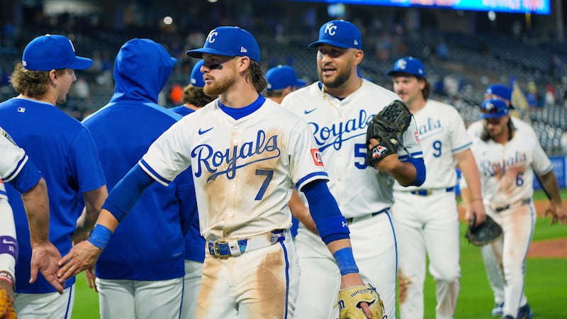 Kansas City Royals' Bobby Witt Jr. (7) celebrates with teammates after their baseball game...
