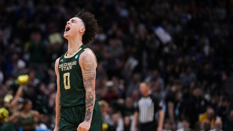 Colorado State guard Kyan Evans reacts after making a three-point basket during the second...