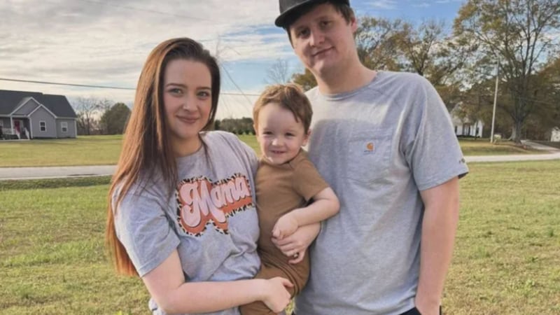 Cheyenne and Peter Martinson with their son.