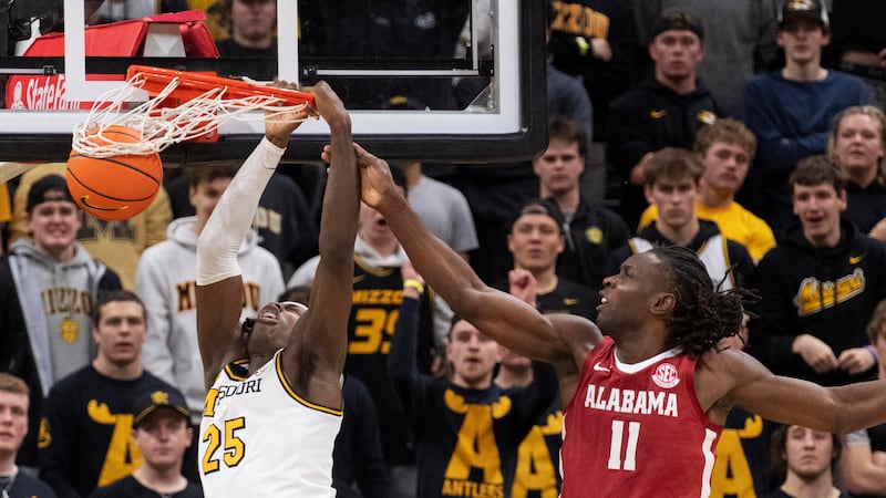 Missouri's Mark Mitchell (25) is fouled as he dunks by Alabama's Clifford Omoruyi (11) during...