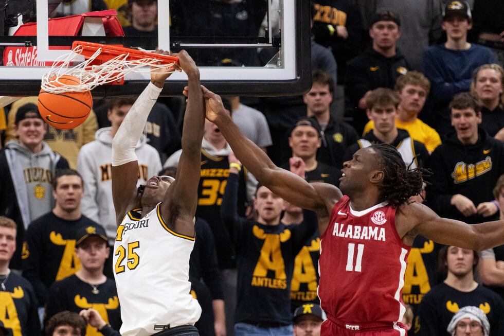 Missouri's Mark Mitchell (25) is fouled as he dunks by Alabama's Clifford Omoruyi (11) during...