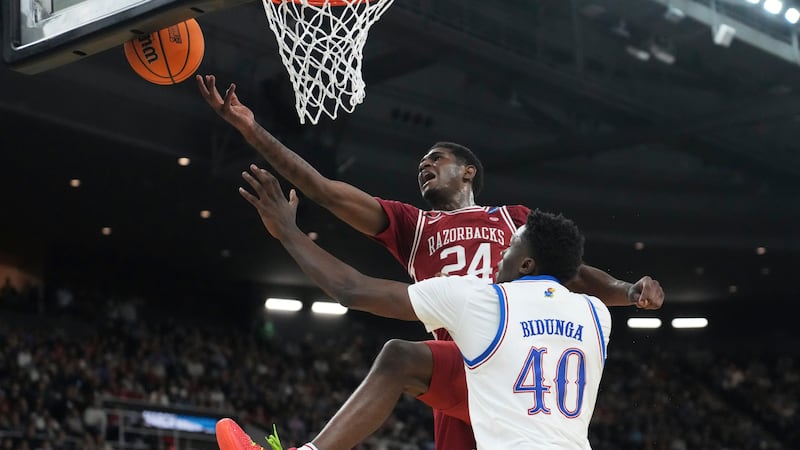 FILE - Arkansas forward Billy Richmond III (24) tries to grab a rebound against Kansas forward...