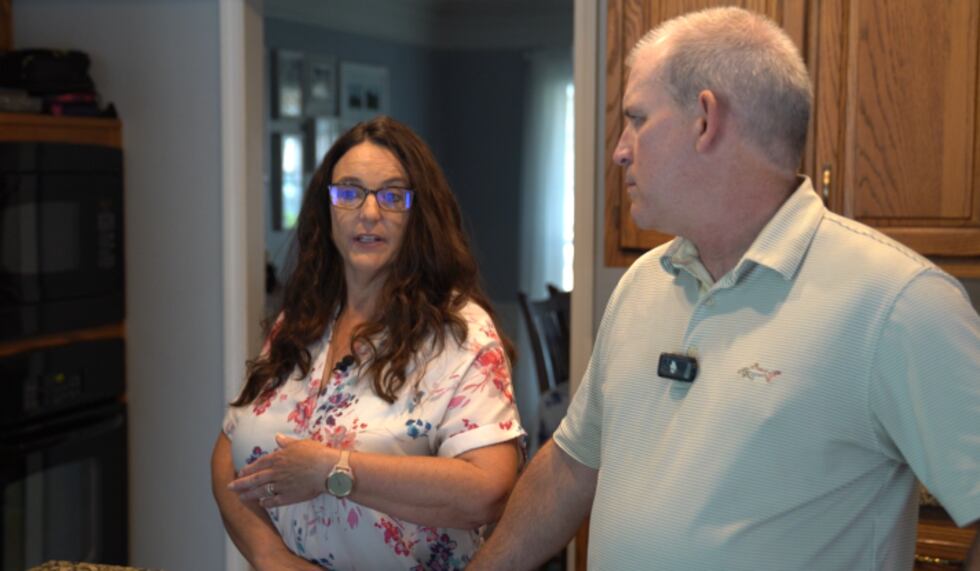 Deonne and Scott Hobson in their kitchen in Overland Park.