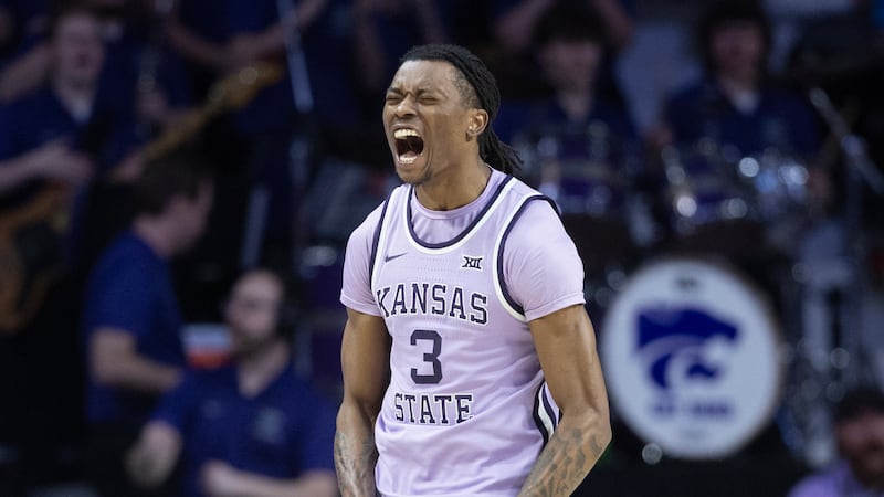 Kansas State's C.J. Jones celebrates a shot and a foul during the first half of an NCAA...