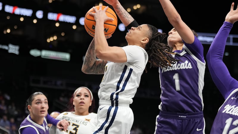 The K-State Wildcats and West Virginia Mountaineers compete during the Phillips 66 Big 12...