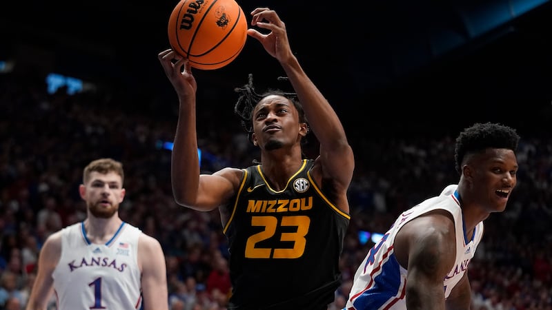 Missouri forward Aidan Shaw (23) grabs a rebound during the first half of an NCAA college...