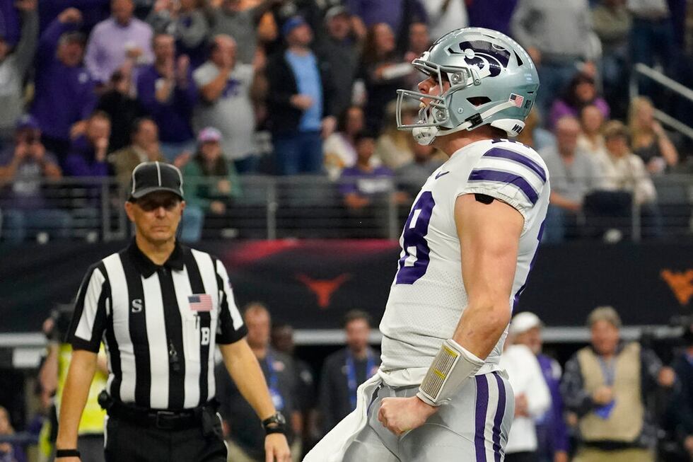 Kansas State quarterback Will Howard (18) celebrates his touchdown in the first half of the...