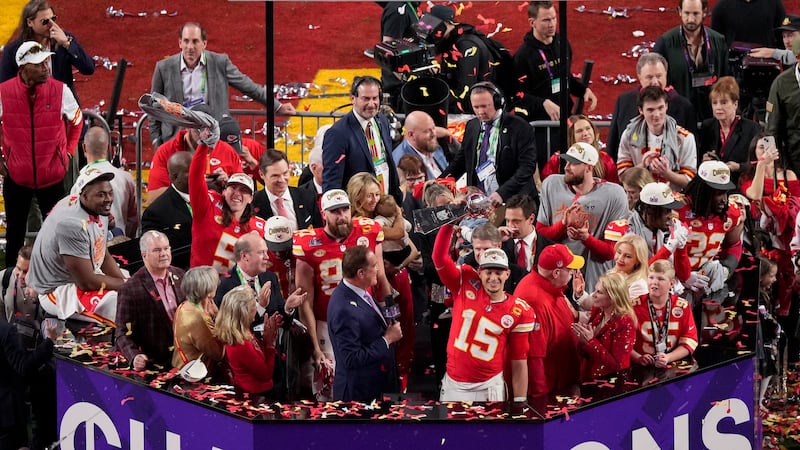 Kansas City Chiefs quarterback Patrick Mahomes (15) lifts the Vince Lombardi Trophy after the...