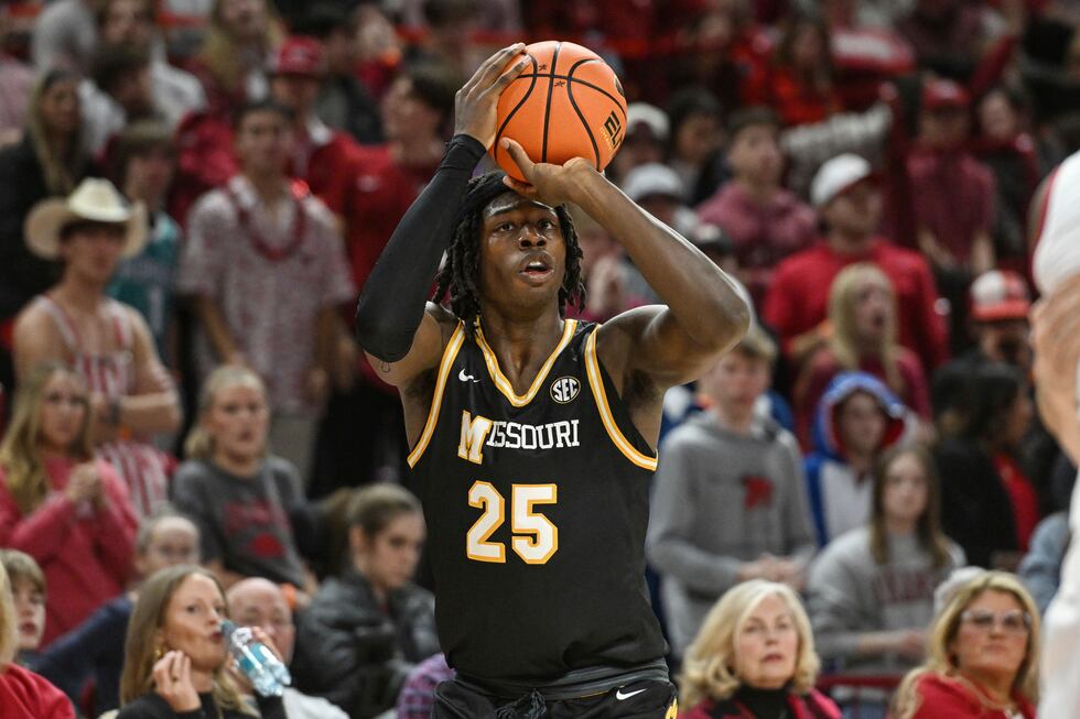 Missouri guard Mark Mitchell (25) shoots a three point shot against Arkansas during the first...