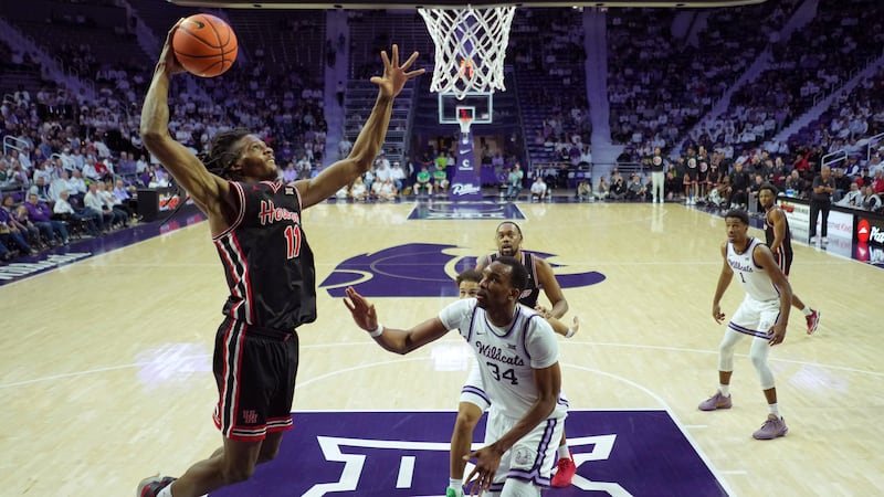 Houston forward Joseph Tugler (11) gets past Kansas State center Ugonna Onyenso (34) to dunk...