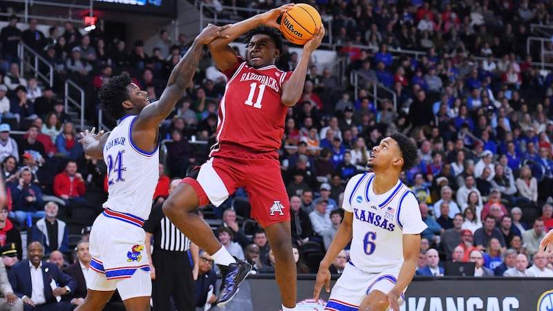 Arkansas forward Karter Knox (11) drives to the basket against Kansas during the first half in...