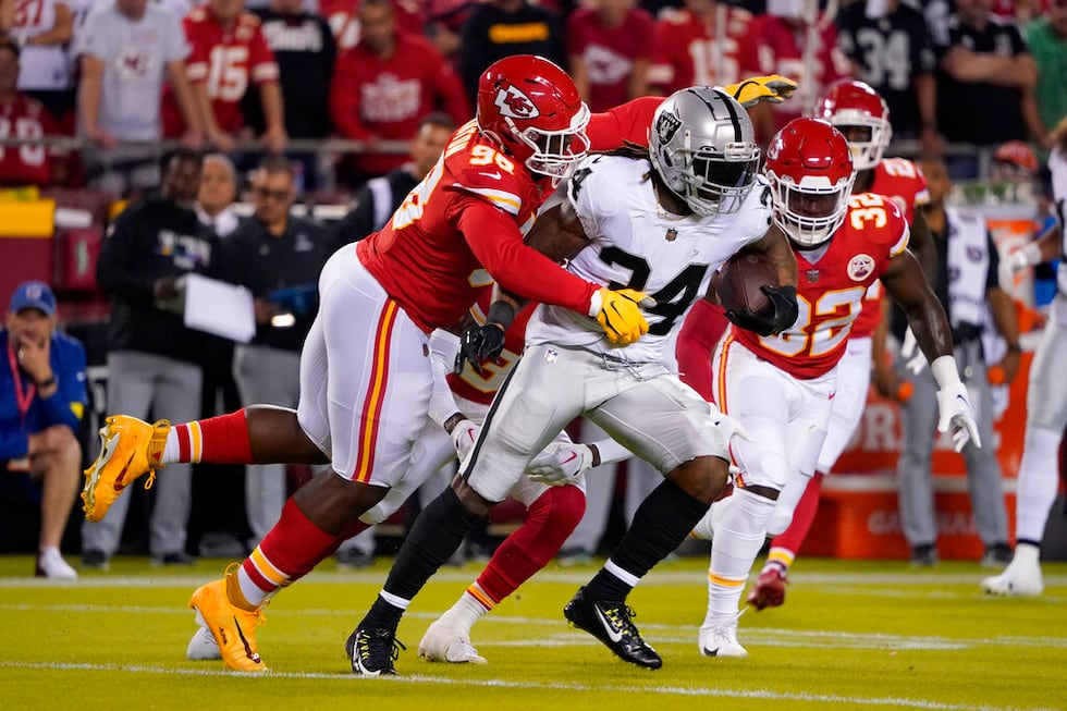 Las Vegas Raiders running back Brandon Bolden (34) runs with the ball as Kansas City Chiefs...