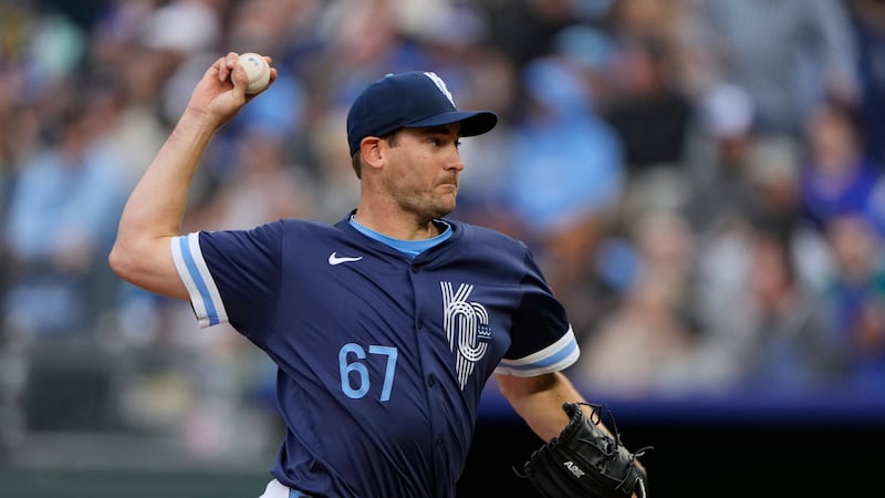 Kansas City Royals starting pitcher Seth Lugo throws during the first inning of a baseball...