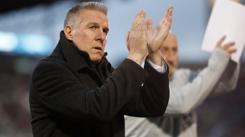 FILE: Sporting Kansas City head coach Peter Vermes acknowledges fans as he takes the pitch to...