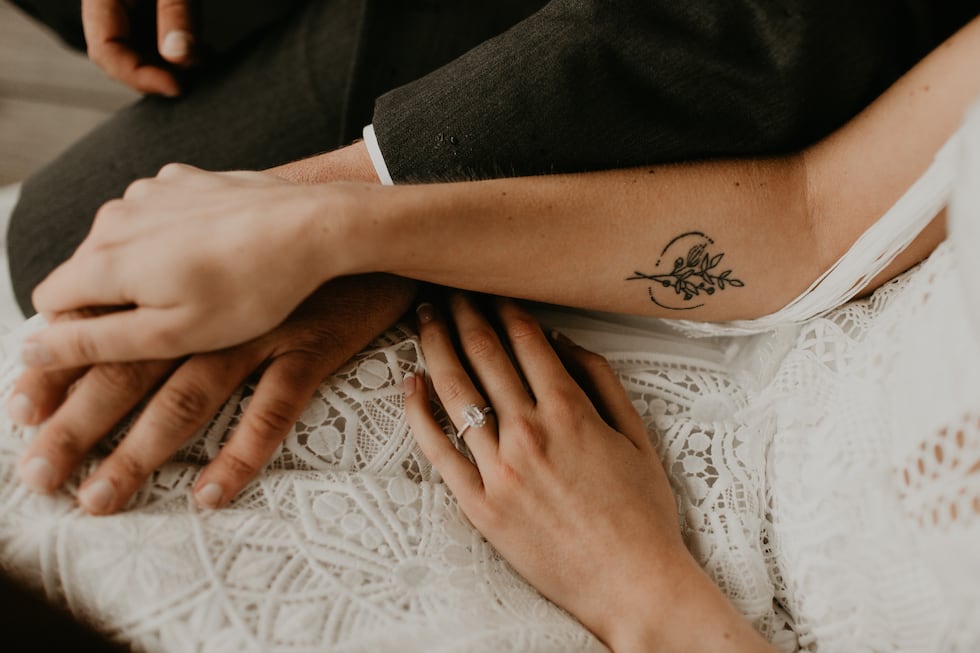 Kelsey Rohrer and her husband with her engagement ring.