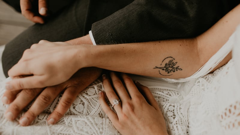 Kelsey Rohrer and her husband with her engagement ring.