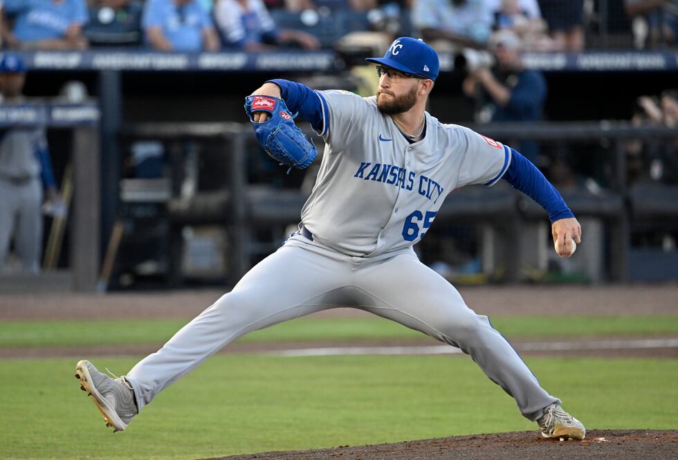 Kansas City Royals pitcher Noah Cameron throws during the first inning of a baseball game...