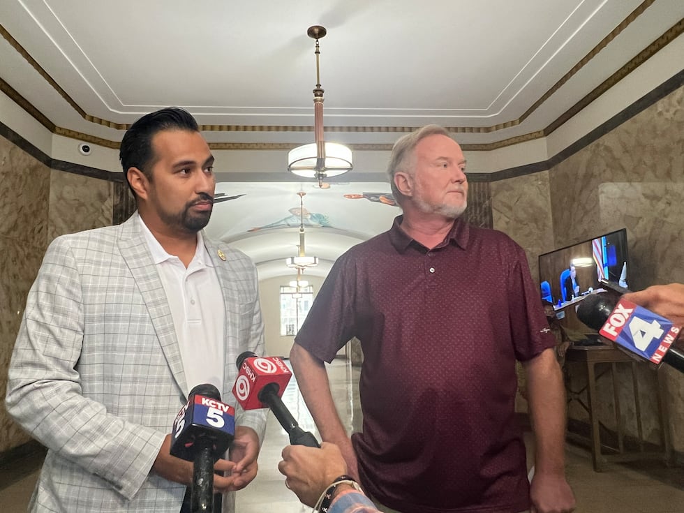 Jacksoun County legislators Manny Abarca (left) and Sean Smith address their concerns over the...