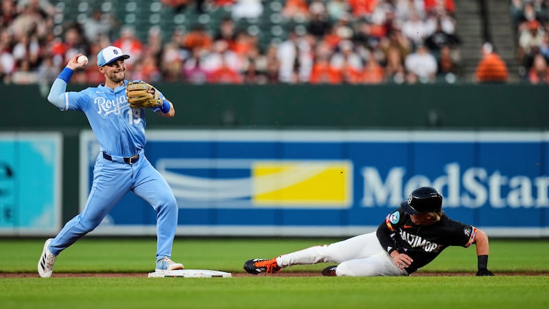 Baltimore Orioles' Jackson Holliday, right, is forced out by Kansas City Royals second baseman...