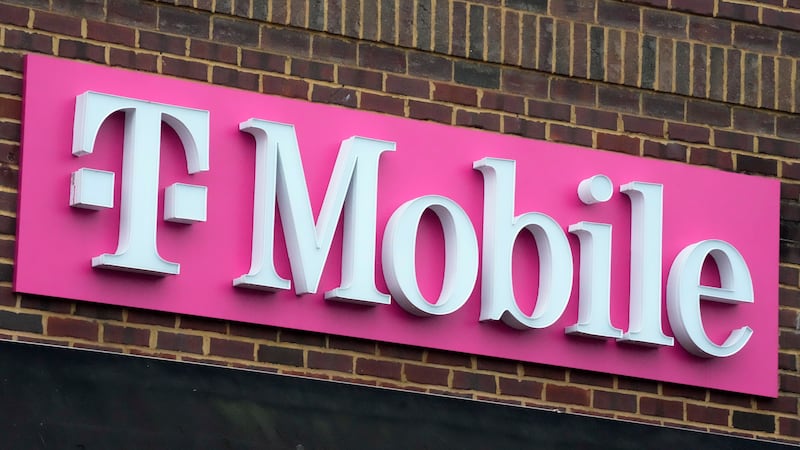 FILE - The sign for a T-Mobile store is seen, Jan. 30, 2023, in Pittsburgh. T-Mobile plans to...