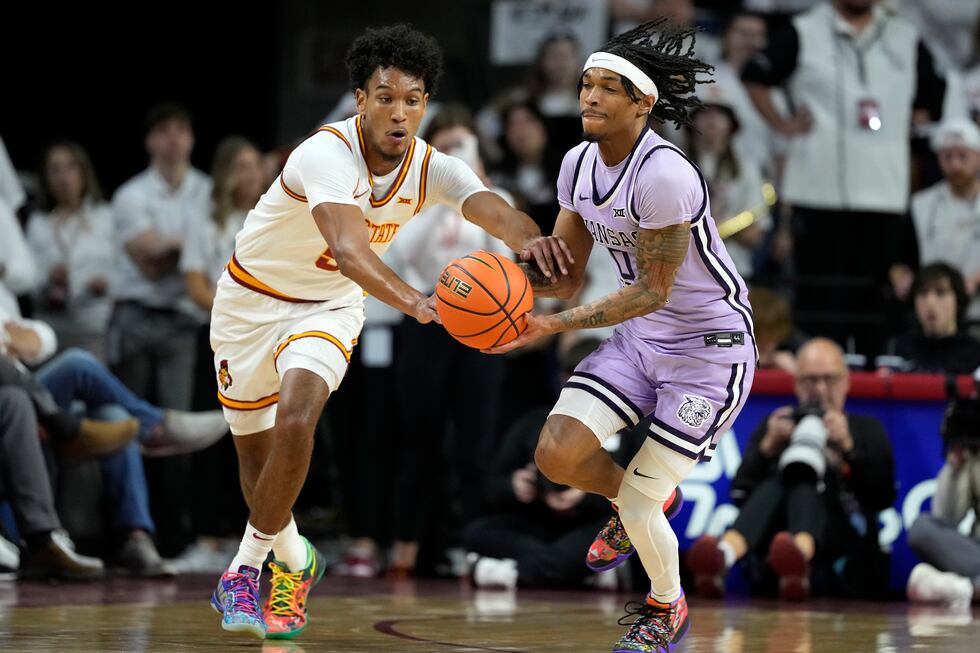 Kansas State guard Dug McDaniel (0) steals the ball from Iowa State guard Curtis Jones, left,...