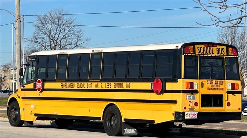 An undated photo shows a Lee's Summit, Missouri, school bus parked at a school.