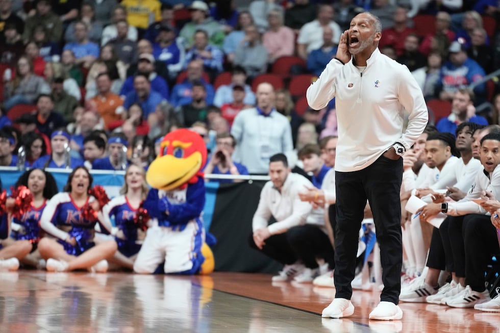 Kansas acting head coach Norm Roberts reacts during the first half of a second-round college...