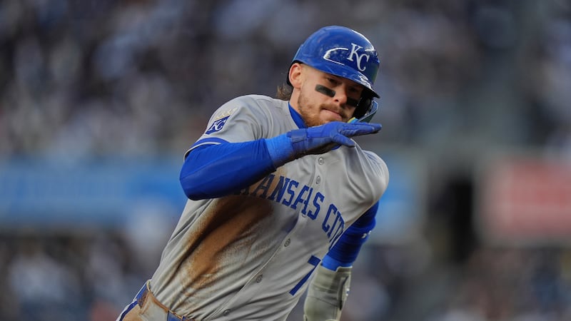 Kansas City Royals' Bobby Witt Jr. turns toward home plate to score on an RBI single by...